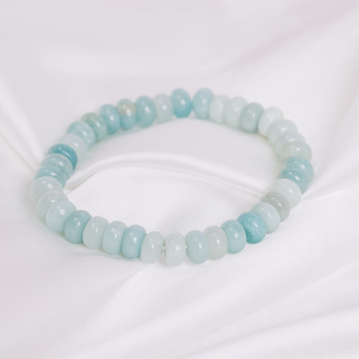 an  amazonite bracelet on a white sheet 