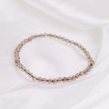 smokey quartz stone bracelet on a white cloth